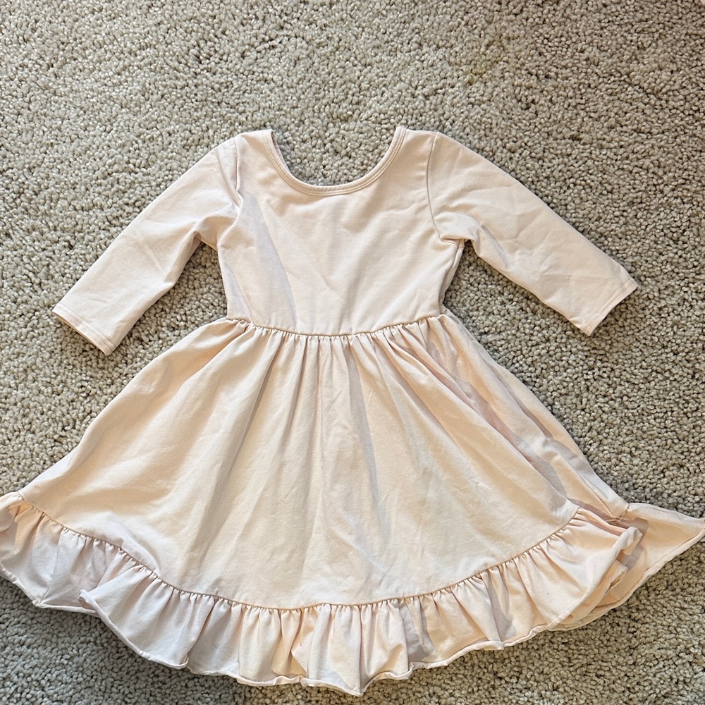 Little Stocking Co Cream twirl Dress with Ruffle Hem